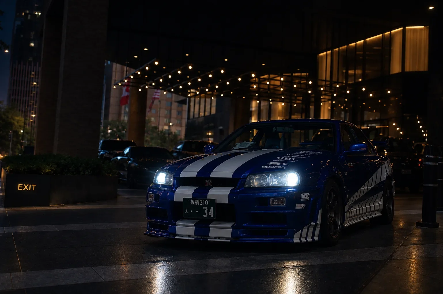 R34 Skyline at a Tokyo hotel entrance at night